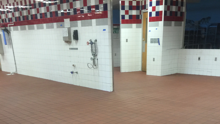 Commercial facility with tiled walls and a hard-wearing quarry-tile floor